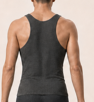 Close crop of Alex's upper back and rear shoulders.