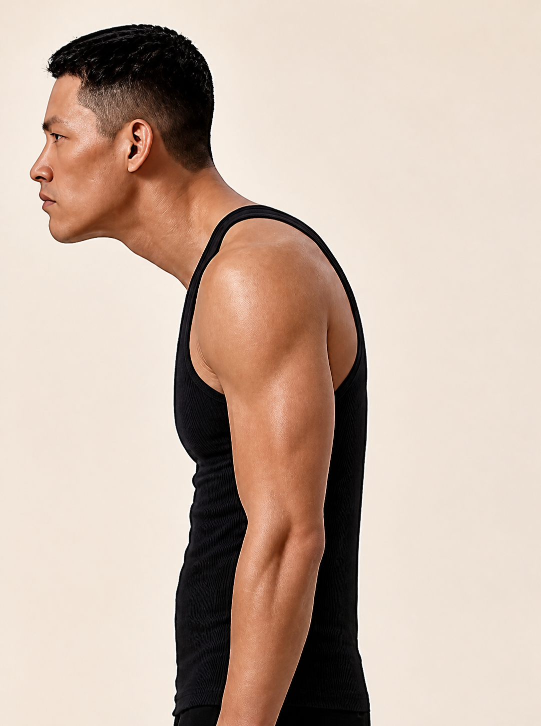 Close crop of Alex's side-profile head, neck and shoulder line.