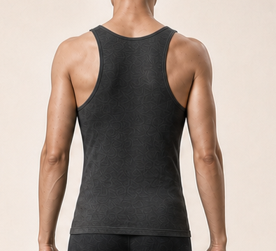 Close crop of Alex's upper back and rear shoulders.